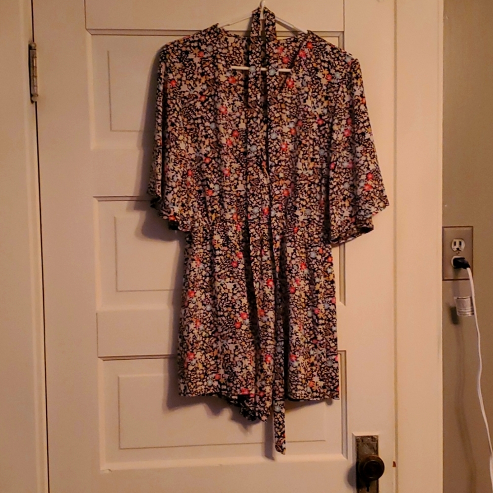 Romper size medium. Never worn.